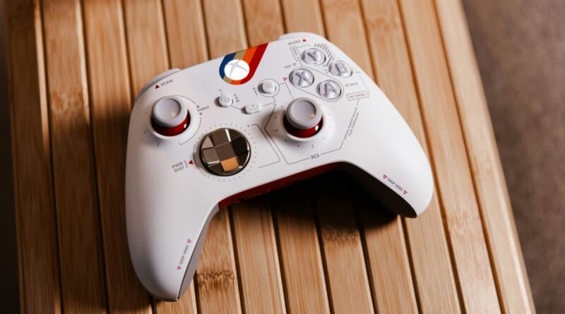 a white controller sitting on top of a wooden table